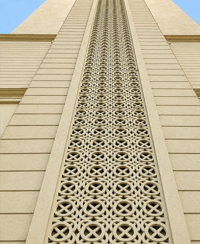 Modern building facade with geometric jali panel cladding for ventilation and design